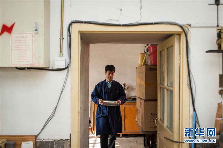 Uhren-Reparateur in der Verbotenen Stadt